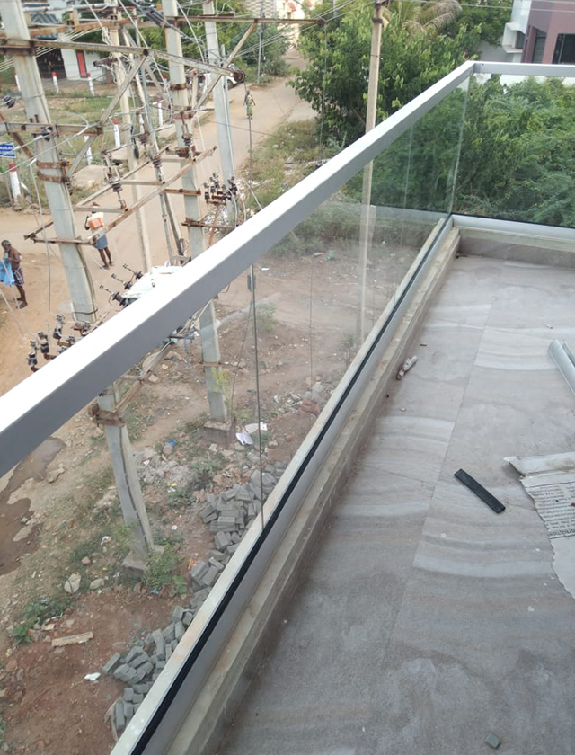 Weather-proof glass canopy installation in Madurai for Karur entrances